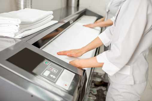Laundry ironing machines & presses